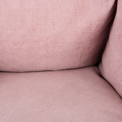 Nærbillede af lyserødt tekstilbetræk med synlige vævningsdetaljer. Materialet fremstår som stof uden synligt mønster eller mærke.
