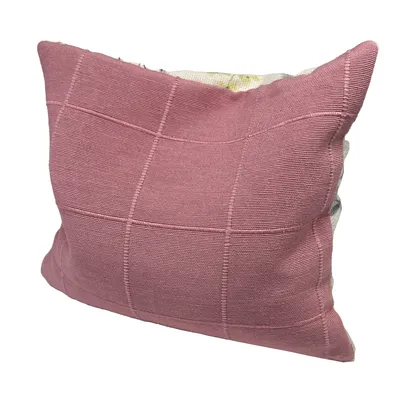 Pink cushion with square pattern and textured surface, suitable for decoration or comfort.