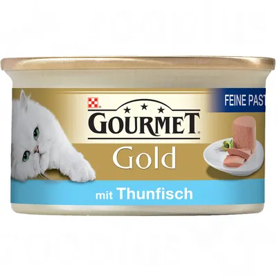 GOURMET Gold mit Thunfisch, Feine Pastete. Blik kattenvoer met afbeelding van witte kat en plakjes paté op een bord. Merknaam en productinformatie in het Duits zichtbaar.