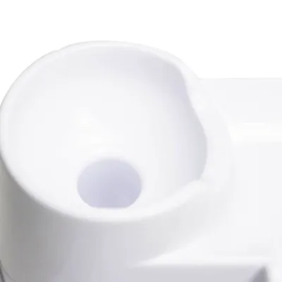 Close-up of a white plastic bowl with a central hole, designed for dispensing water or food.