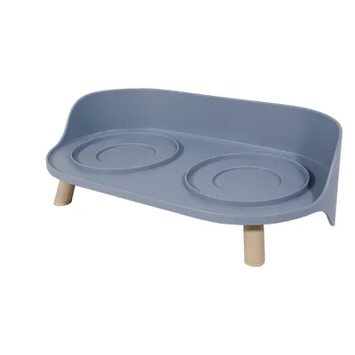 Suporte azul para comedouros com dois recessos redondos e pés bege, adequado para dois comedouros.