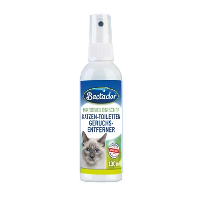 Spray Bactador, 100 ml. Texto visible en alemán: 'Mikrobiologischer Katzen-Toiletten Geruchs-Entferner'. Imagen de un gato y sello 'Original Sehr Gut'.