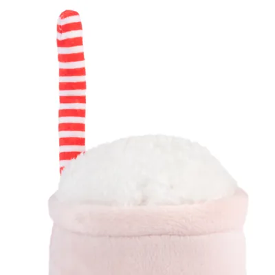 Plišasta igrača z belo površino in rdeče-belim črtastim tekstilnim elementom.