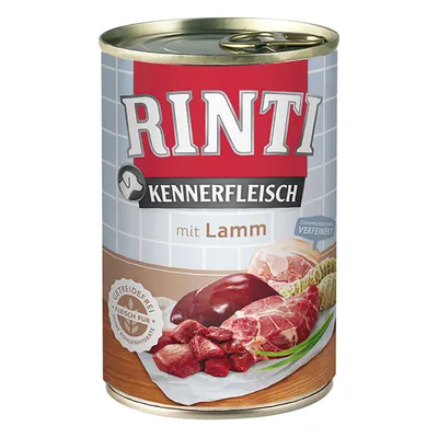Scatola di cibo per cani Rinti Kennerfleisch mit Lamm, con immagini di carne e scritte: Getreidefrei, Fleisch pur, senza carboidrati, Zusammensetzung verfeinert.