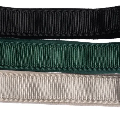 Three nylon dog collars in black, green and beige, arranged side by side.