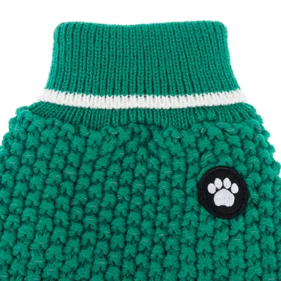 Green knitted jumper with white stripe on collar and black patch with paw print.