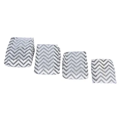 Four grey dog nappies with zigzag pattern arranged side by side in different sizes.