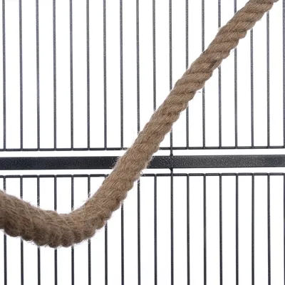 Close-up of a brown rope in front of a black metal grid, suitable for cage accessories or decoration.