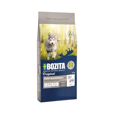 Bozita Puppy & Junior XL mit Lamm, 12 kg. Weizenfreie Rezeptur, 24% Protein, 13% Fett. Made in Sweden. Für Welpen und junge Hunde. Verpackung zeigt Husky-Welpe im Wald.