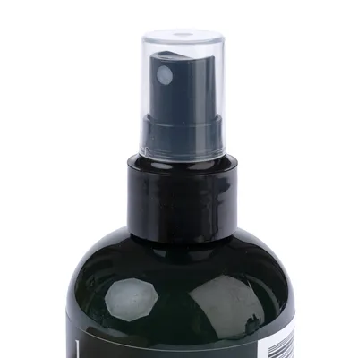 Black spray bottle with transparent cap, suitable for liquids. Label partially visible.