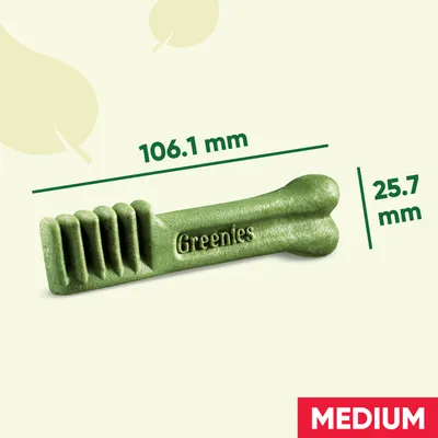 Greenies dental chew with dimensions shown: 106.1 mm length and 25.7 mm width. Label indicates medium size.