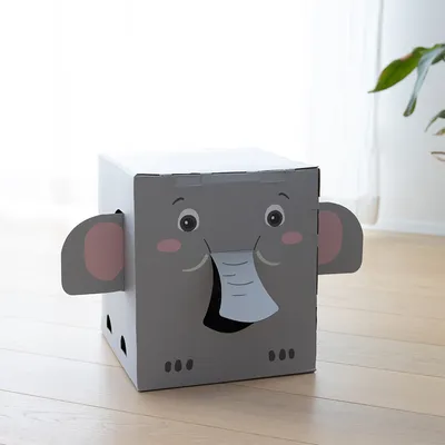 Grey play box in elephant shape with ears, eyes and trunk. Front opening as entrance. Suitable for pets or children to play.