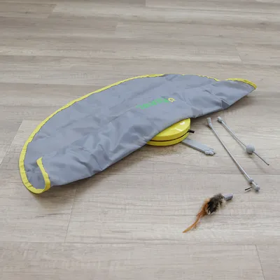 Toy set with grey cover, yellow base and accessories such as rods and feather attachments. Suitable for interactive play.