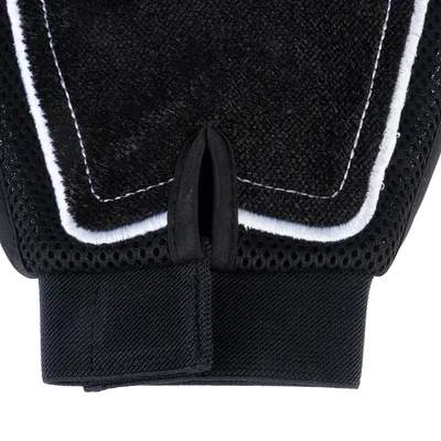 Close-up of a black glove with hook-and-loop fastener and breathable mesh material.
