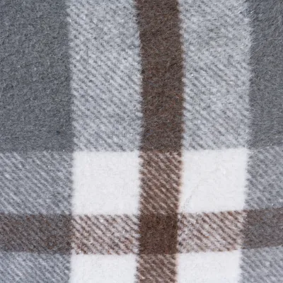 Close-up of a checked fabric pattern in grey, white and brown. Shows the texture of the material.