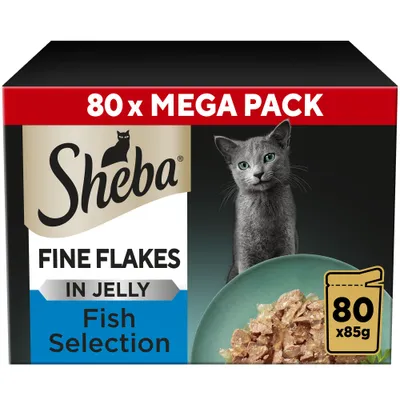 Sheba Fine Flakes in Jelly Fish Selection, 80 x 85g mega pack. Image shows product packaging and a bowl of fine flakes in jelly.