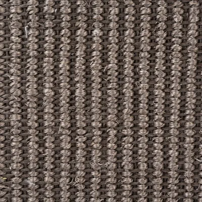 Närbild av en brun, vävd textur av robusta fibrer. Materialdetaljer för produktbeskrivning.