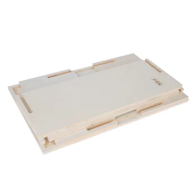 Stacked wooden panels with FDX logo, presumably as components for a product.