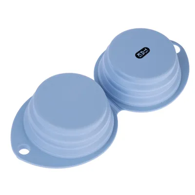 Two collapsible blue silicone bowls with a small black logo on one of the bowls. Suitable for travel or space-saving storage.