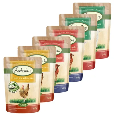 Selection of Lukullus 300g pouches in various flavours, each labelled with ingredients and weight. Multiple packs shown together for variety.