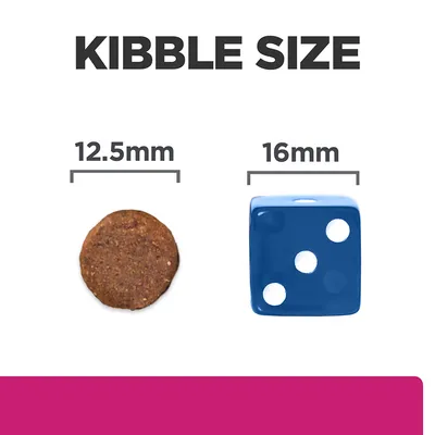 Kibble size comparison showing a 12.5mm round kibble next to a 16mm blue die for scale.