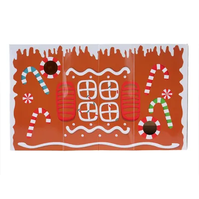 Lebkuchenhaus-Design mit Zuckerstangen, Fenster und dekorativen Elementen. Produktverpackung für festliche Haustierartikel.