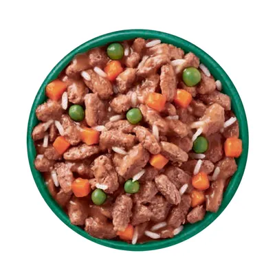 Tray with wet food, visible meat pieces, peas, diced carrots and rice in gravy.