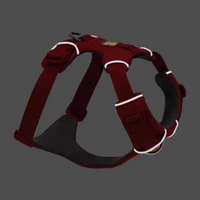 Red harness with reflective stripes, adjustable straps and padded inner material. Suitable for pets, visibly robust design.