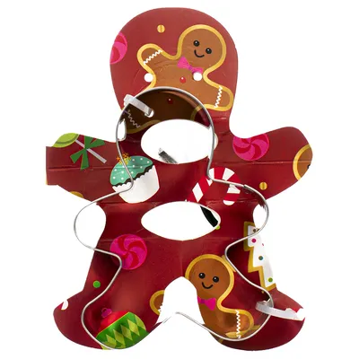 Forma de cortar bolachas em forma de boneco de gengibre em metal, com fundo vermelho e motivos natalícios como bengalas doces, cupcakes e presentes.