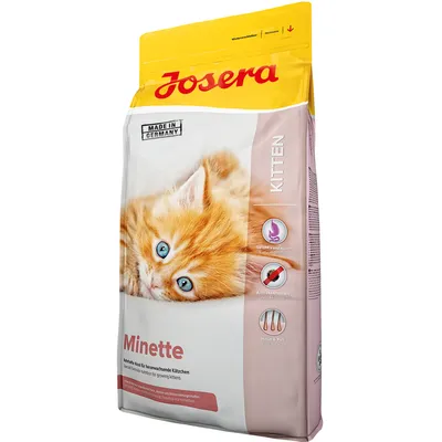 Josera Minette Kitten -kuivaruoka kissanpennuille, näkyvissä tekstit: Made in Germany, Easy digestible, Anti-Hairball, Skin & Coat. Pakkauksessa oranssi kissanpentu.