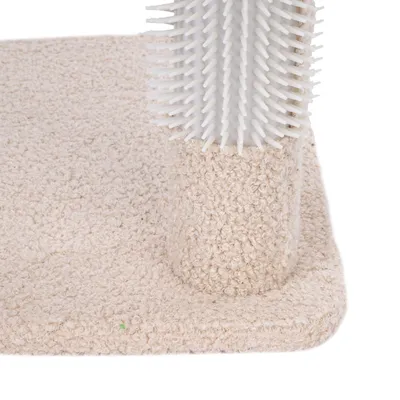 Beige carpet with textured surface and white plastic attachment with bristles. Close-up of a scratching post accessory.