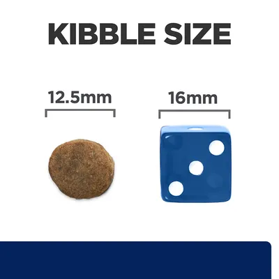 Kibble size comparison showing a 12.5mm round kibble next to a 16mm blue dice for scale.