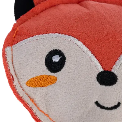 Close-up of an orange fabric toy shaped like a fox face with embroidered eyes, nose and mouth.