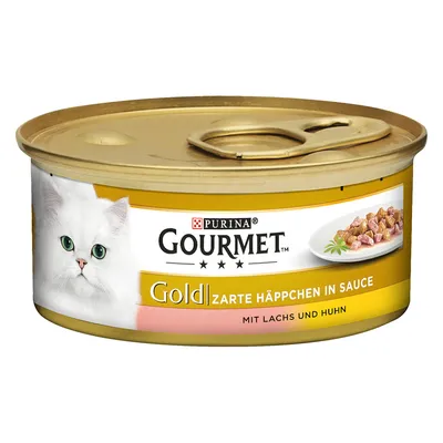 Purina Gourmet Gold Zarte Häppchen in Sauce, mit Lachs und Huhn. Blik met afbeelding van witte kat en stukjes vlees op een bord. Tekst deels in het Duits.