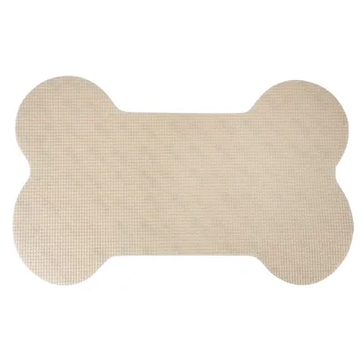 Tapis beige en forme d’os, surface texturée, sans marque ni texte visible. Matière plastique apparente.