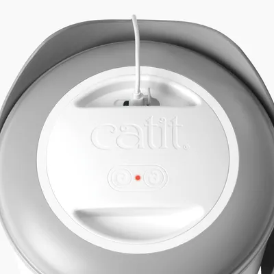 Catit drinking fountain with cable connection and indicator light, suitable for clean water.