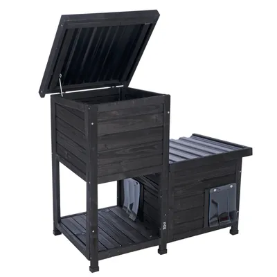 Schwarzes Holzhaus mit zwei Bereichen, aufklappbarem Dach und transparenten Klappen an den Eingängen.