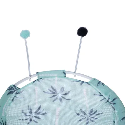 Spielzeug mit zwei flexiblen Stäben und Pompons, Stoff mit Palmenmuster in Grün und Weiss.