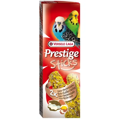 Versele-Laga Prestige Sticks, 2x ägg och ostronskal. Förpackningen visar två undulater och ingrediensbilder.