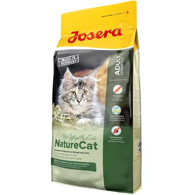 Опаковка Josera NatureCat за котки, Adult Grain Free, Made in Germany, с изображение на котка. Видими са икони: без зърнени храни, pH урина 6,0–6,5, анти-космени топки.