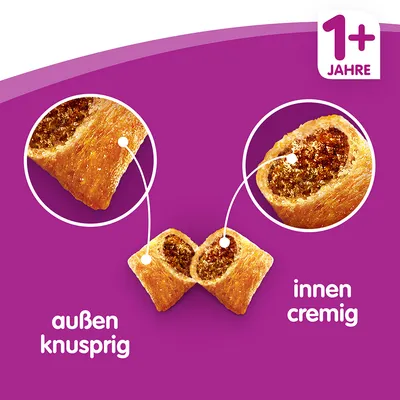 Vue en coupe de friandises fourrées, texte allemand : außen knusprig (extérieur croustillant), innen cremig (intérieur crémeux), 1+ Jahre (1 an et plus)