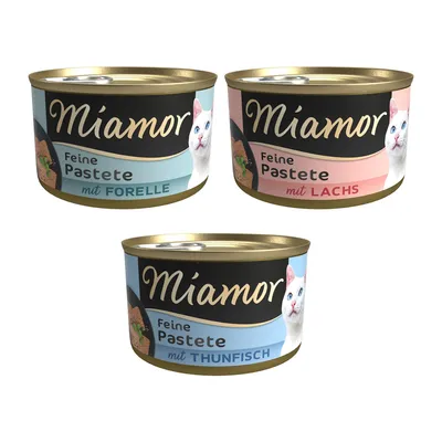 Miamor Feine Pastete in drei Sorten: mit Forelle, mit Lachs und mit Thunfisch. Dosen mit schwarzem Design und Katzenmotiv.