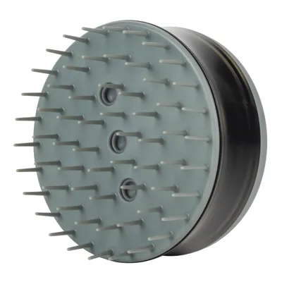 Grå børste med runde plastikpigge og tre huller i midten, egnet til pleje af pels. Materiale: plastik.