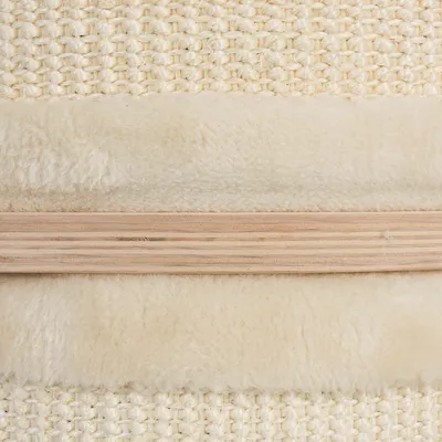 Close-up of materials: woven sisal, soft faux fur and wooden strip. Visible textures for scratching post or furniture.