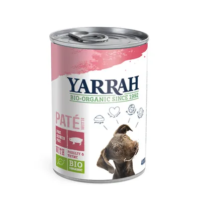 Lata de paté Yarrah Bio-Organic Since 1992, cerdo con perejil y tomillo, 400 g. Texto visible: 'PATÉ WITH PORK', 'BIO ORGANIC', imagen de perro en la etiqueta.