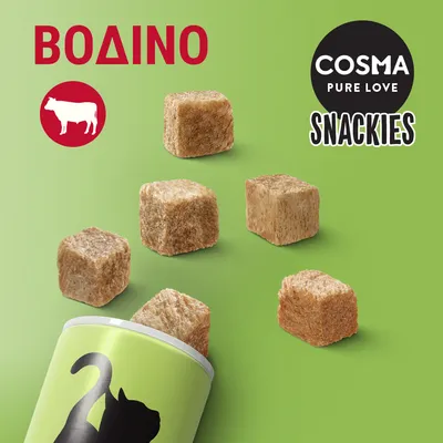 COSMA PURE LOVE SNACKIES, ΒΟΔΙΝΟ. Κύβοι λιχουδιάς για γάτες βγαίνουν από συσκευασία με σιλουέτα γάτας. Ορατό σύμβολο αγελάδας.