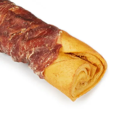 Chew roll made from pressed beef hide, wrapped with dried meat. Visible texture and colour of the product. Chew roll made from pressed beef hide, wrapped with dried meat. Visible texture and colour of the product.