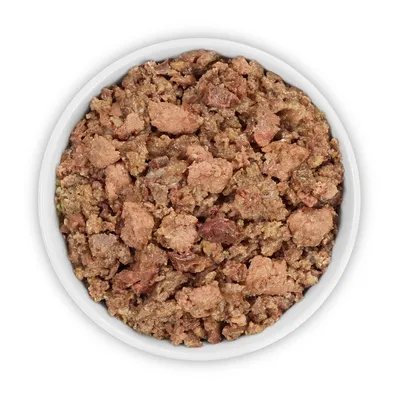 Bowl with moist, shredded pet food in brown and flesh-coloured tones.