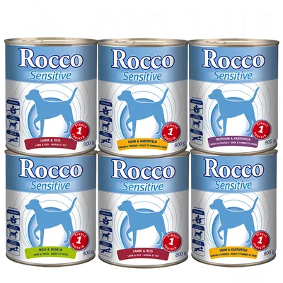 Zes blikken Rocco Sensitive hondenvoer, varianten: Lamm & Reis, Huhn & Kartoffeln, Truthahn & Kartoffeln, Wild & Nudeln. Elk blik 800 g, zichtbaar 'Single Protein' en productnamen.