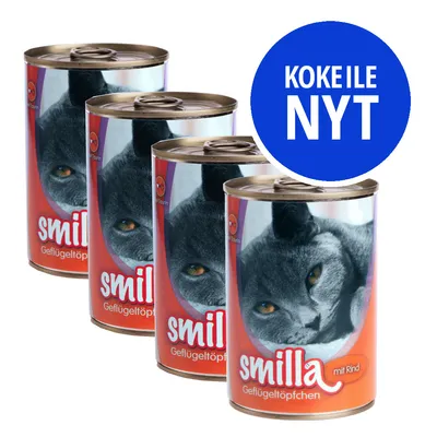 Neljä Smilla-kissanruokapurkkia, etiketissä harmaa kissa ja tekstit 'smilla', 'Geflügeltöpfchen', 'mit Rind'. Sininen ympyrä: KOKEILE NYT.